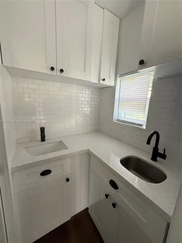 a bathroom with a sink and mirror