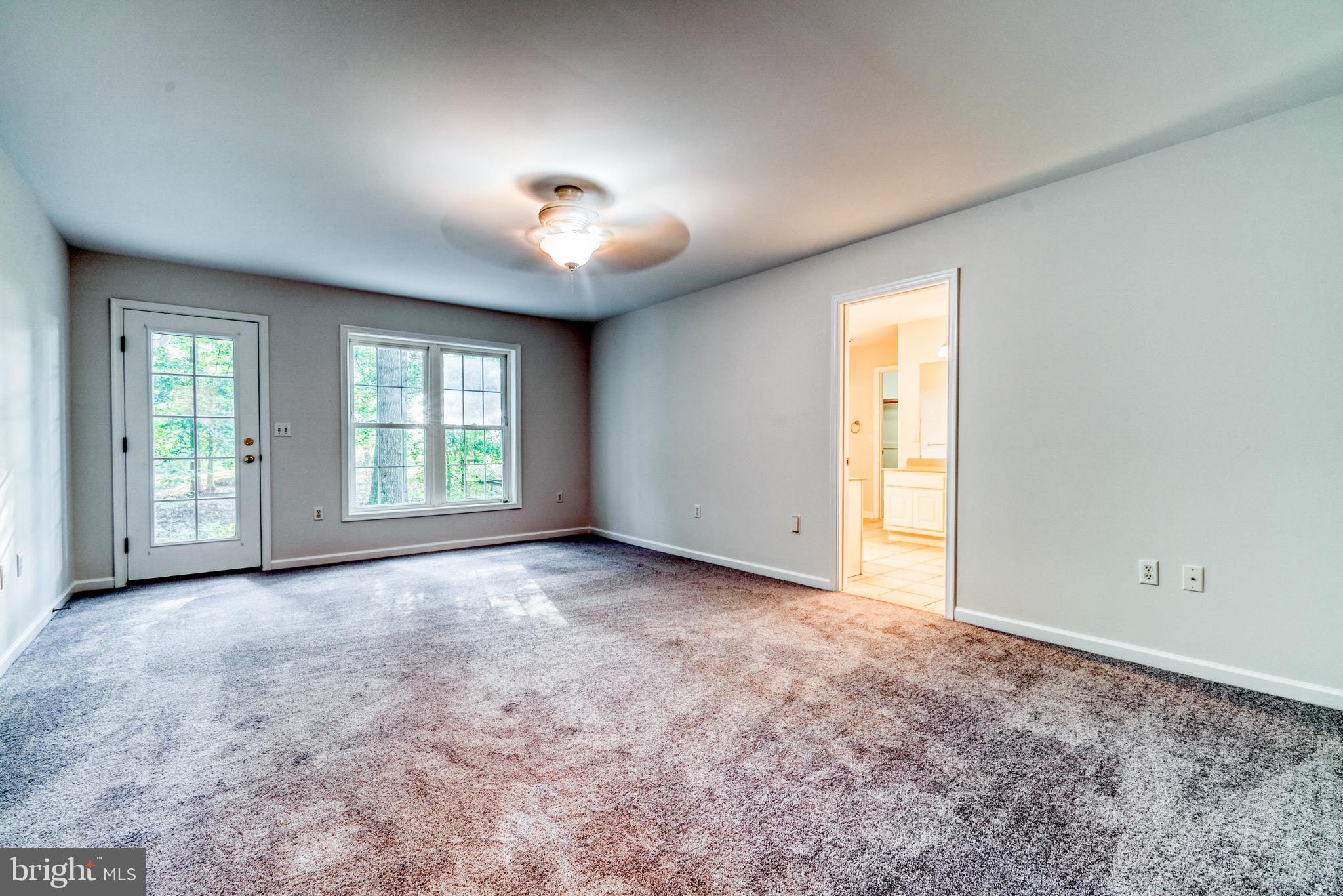 9540 Fairlee Road Chestertown, MD 21620 - Photo 11 of 31 Large primary bedroom with door to back deck