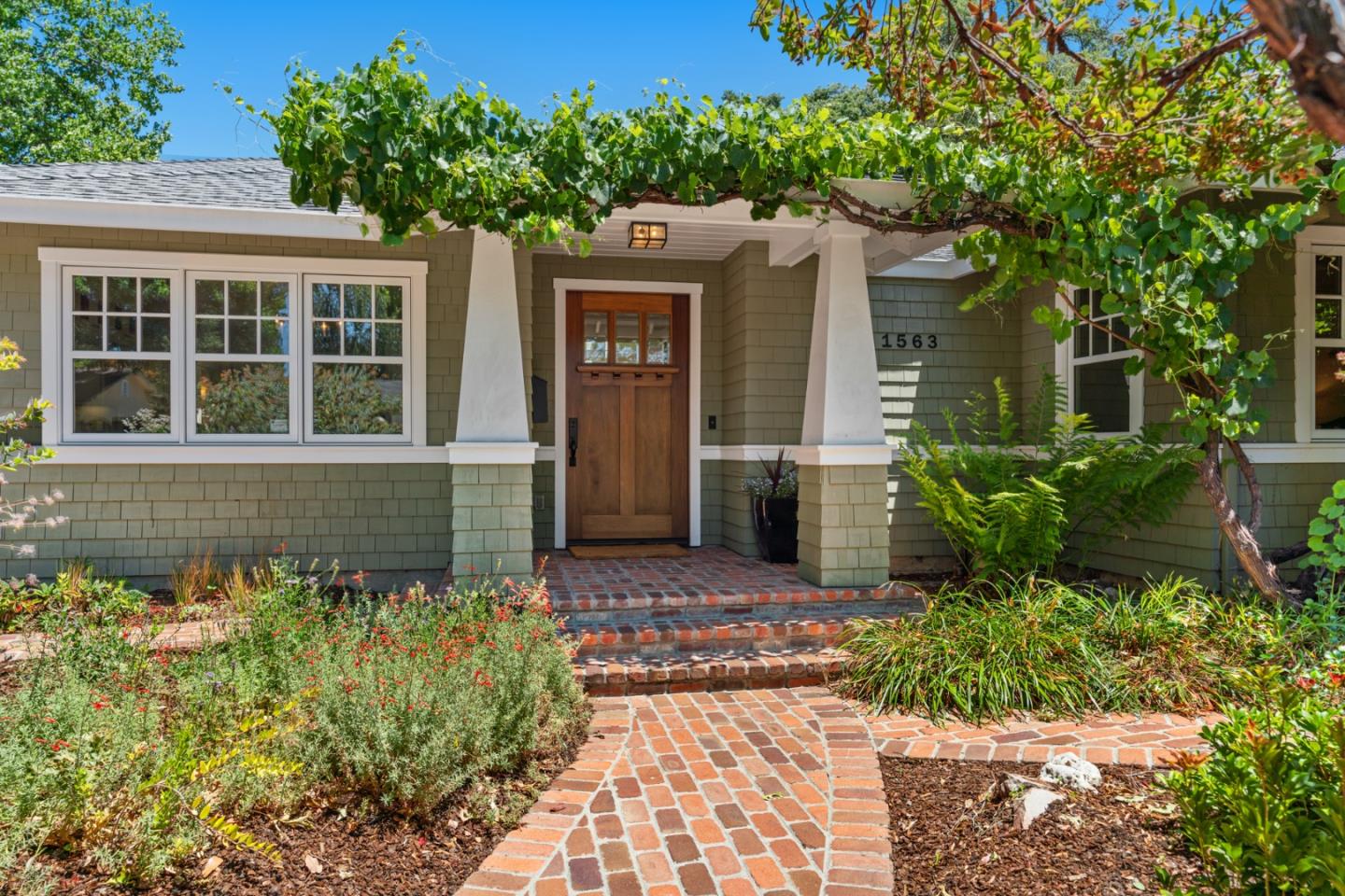 1563 Walnut Drive Palo Alto, CA 94303 - Photo 1 of 41 front view of a house with a yard