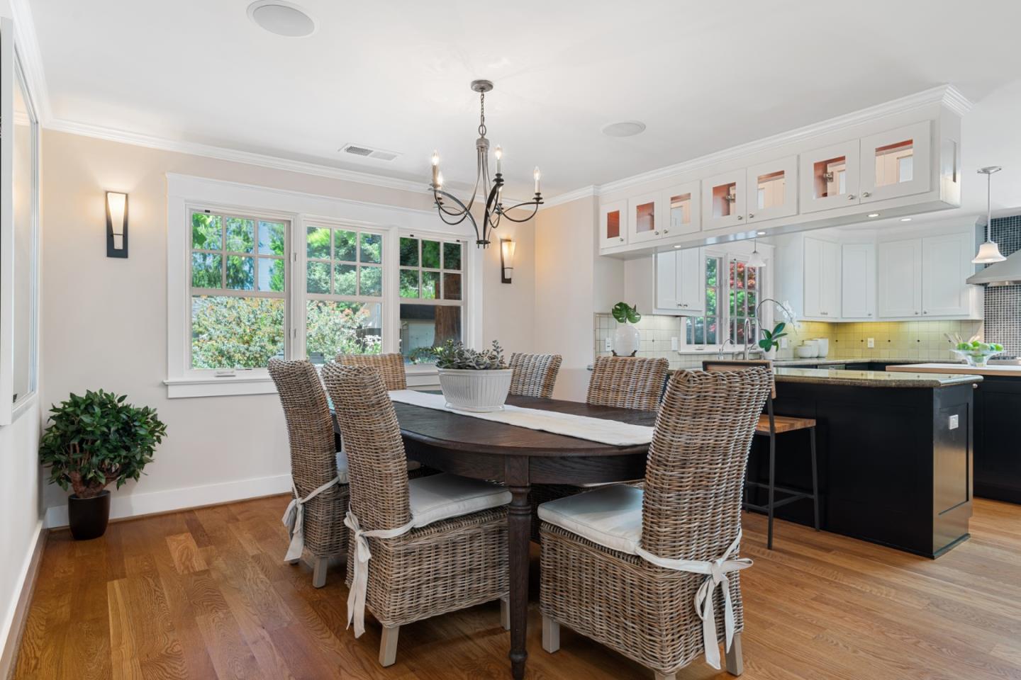 1563 Walnut Drive Palo Alto, CA 94303 - Photo 11 of 41 a dining room with furniture a chandelier and wooden floor