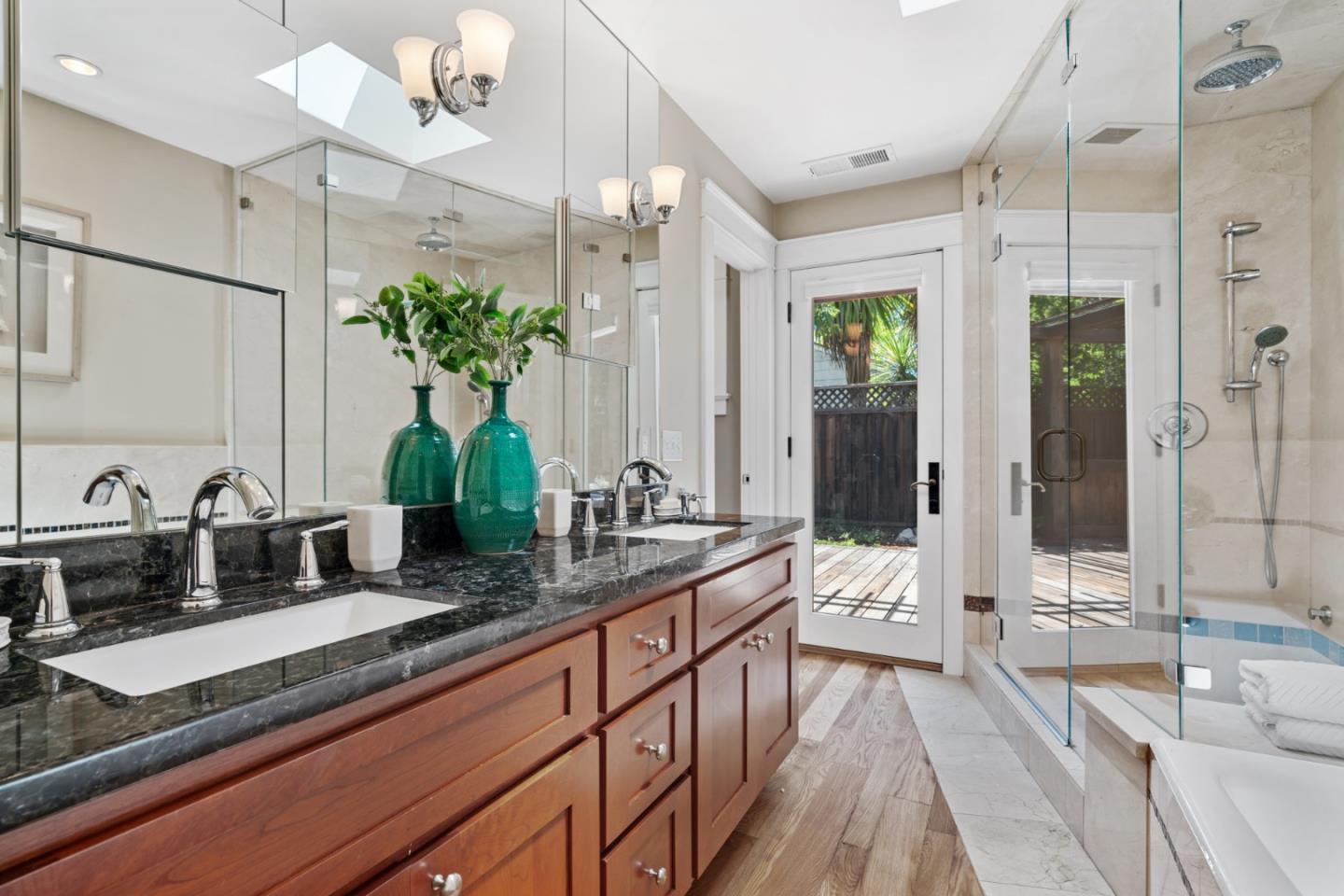 1563 Walnut Drive Palo Alto, CA 94303 - Photo 18 of 41 a kitchen with kitchen island granite countertop a sink and white cabinets