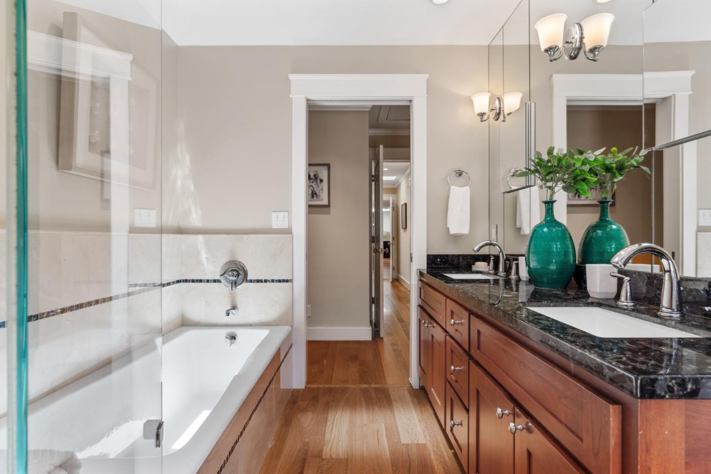 1563 Walnut Drive Palo Alto, CA 94303 - Photo 19 of 41 a spacious bathroom with a granite countertop tub sink and mirror