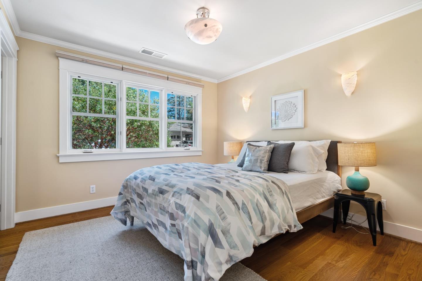 1563 Walnut Drive Palo Alto, CA 94303 - Photo 23 of 41 a bedroom with bed and a window