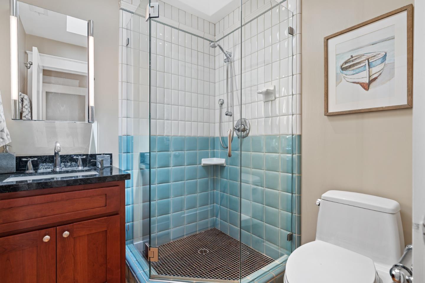 1563 Walnut Drive Palo Alto, CA 94303 - Photo 24 of 41 a bathroom with a toilet a sink and shower