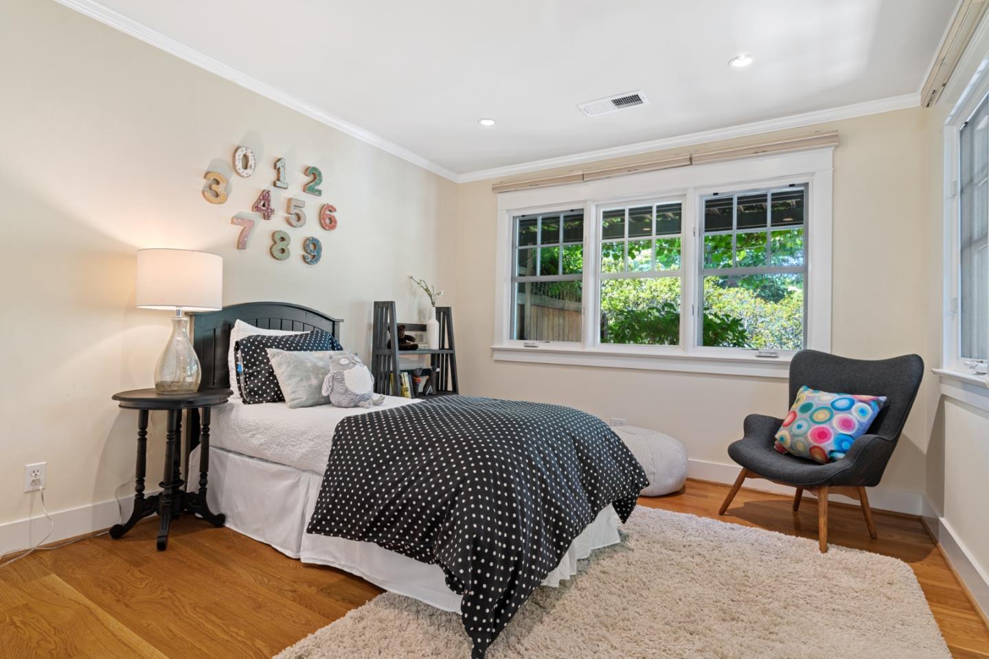 1563 Walnut Drive Palo Alto, CA 94303 - Photo 26 of 41 a bedroom with a bed and a window
