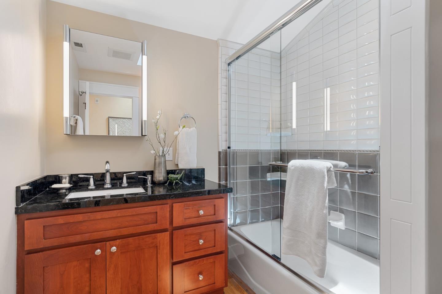 1563 Walnut Drive Palo Alto, CA 94303 - Photo 27 of 41 a kitchen with granite countertop a sink and cabinets