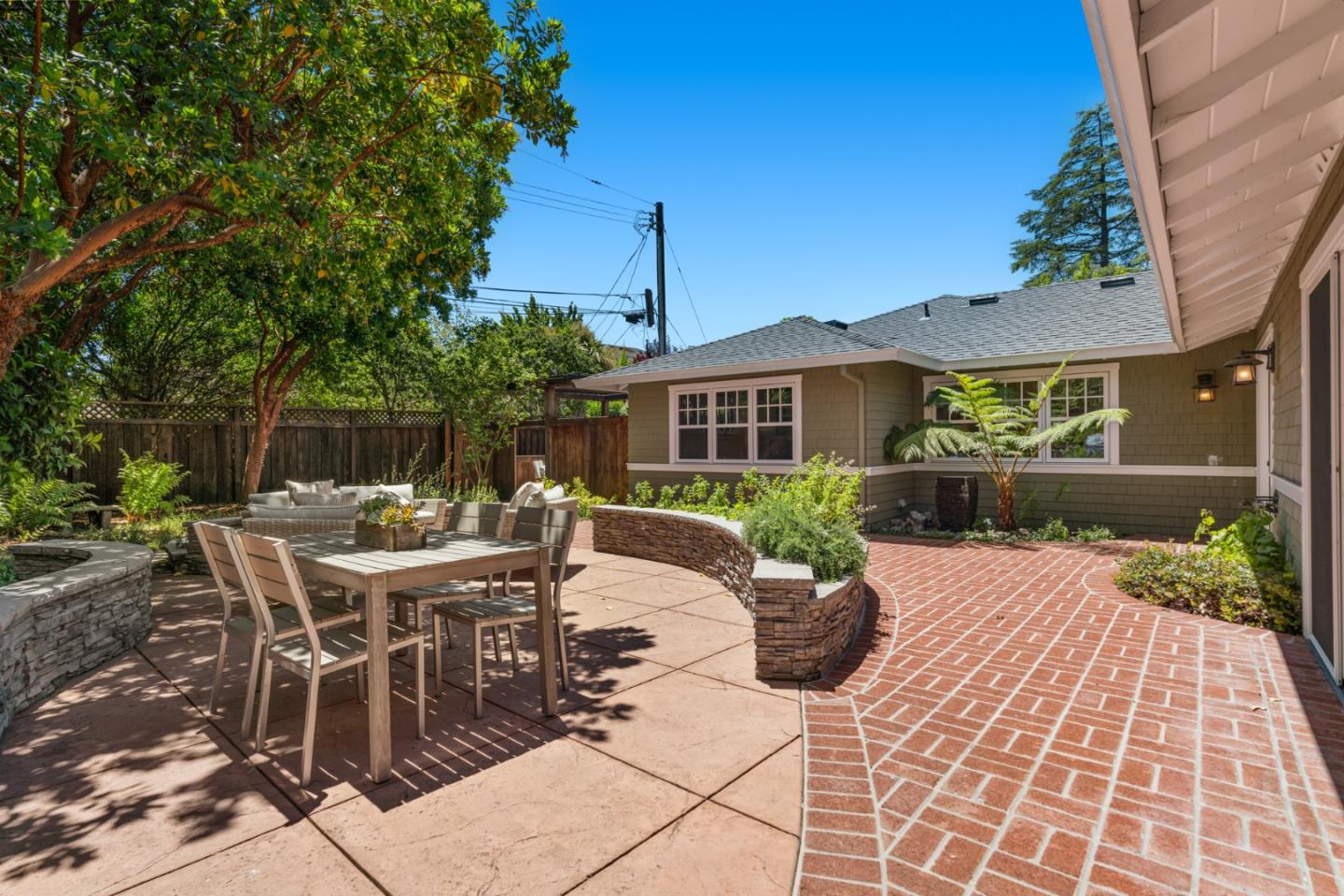1563 Walnut Drive Palo Alto, CA 94303 - Photo 35 of 41 a view of a patio with a table and chairs