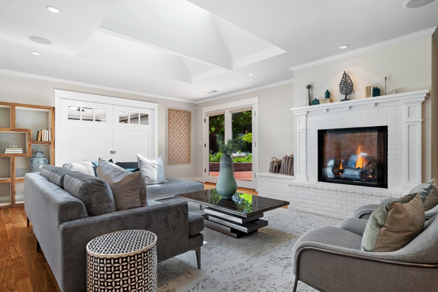 1563 Walnut Drive Palo Alto, CA 94303 - Photo 5 of 41 a living room with furniture a fireplace with projector screen