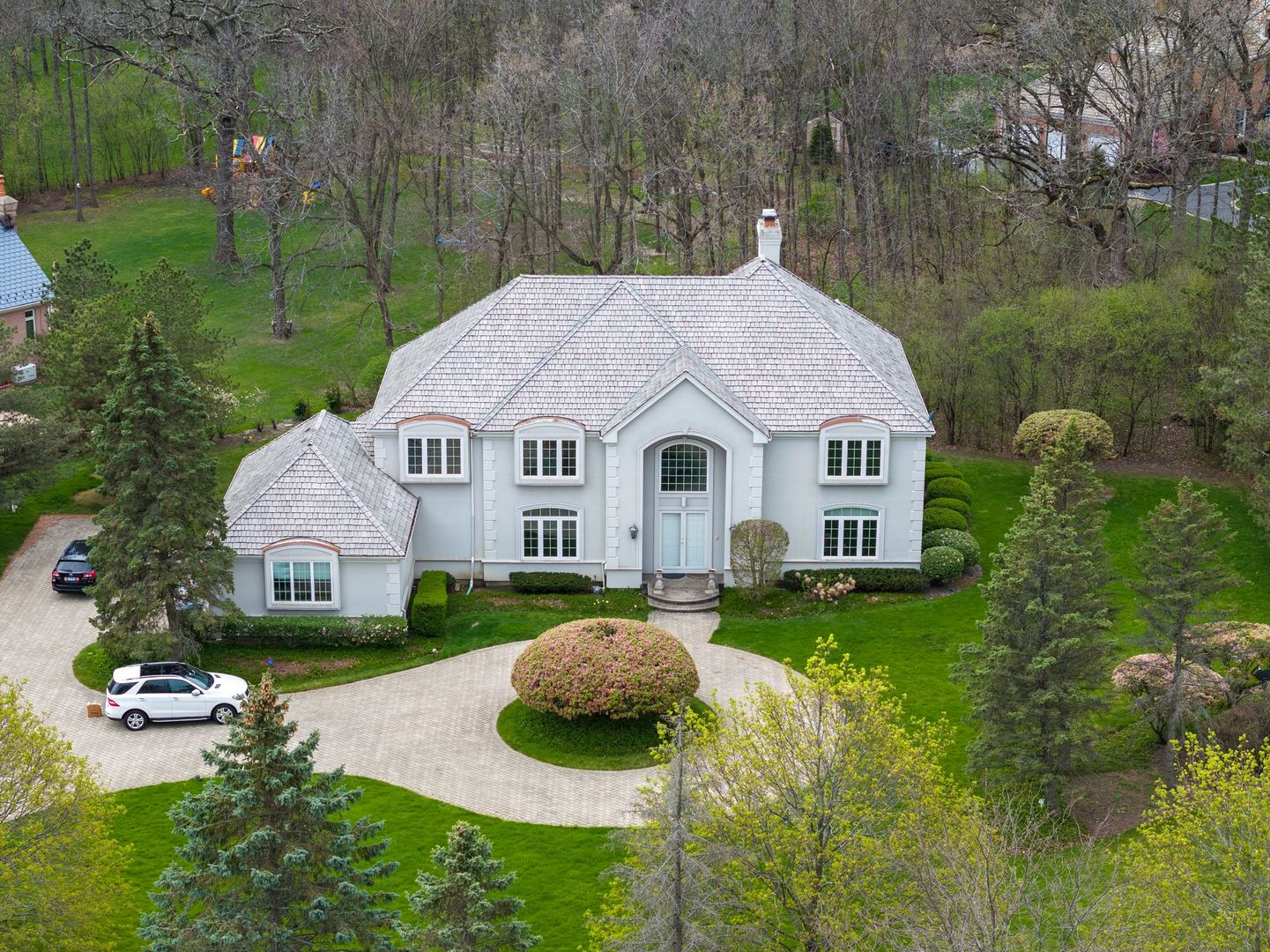 a aerial view of a house with backyard and garden