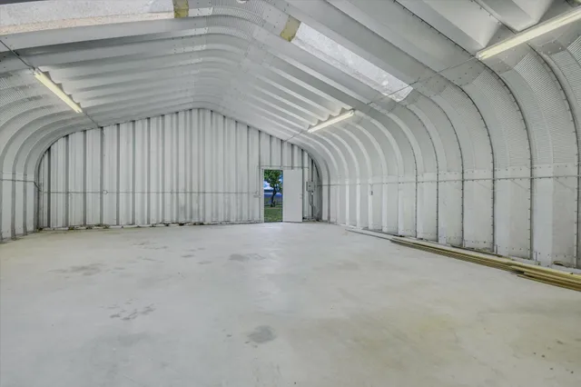 a front view of a house with a garden and porch