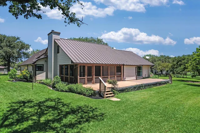 a view of a park with large trees