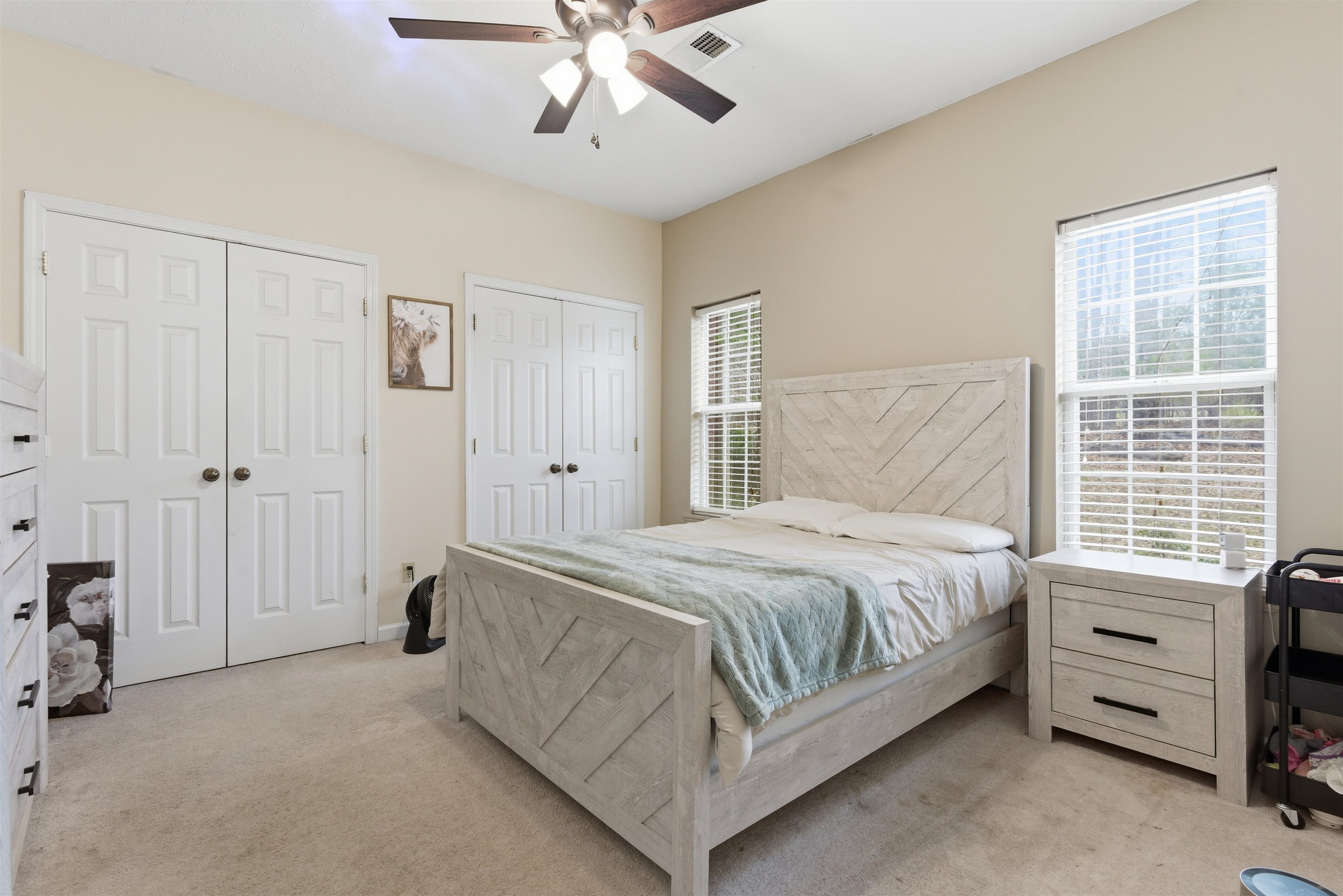 915 Cliffview Road Bolivar, TN 38008 - Photo 24 of 35 a bedroom with a bed and a chandelier