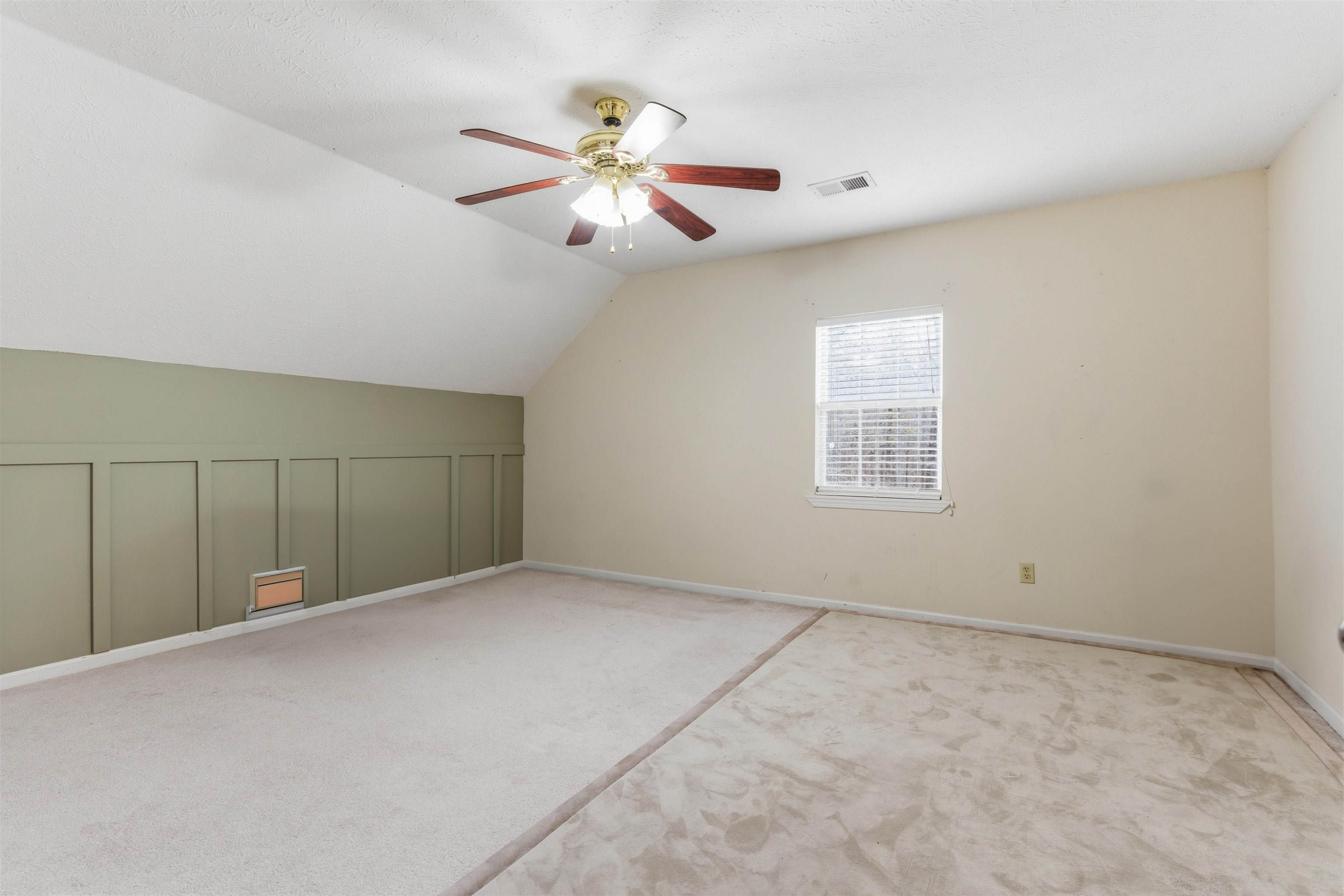 915 Cliffview Road Bolivar, TN 38008 - Photo 26 of 35 a view of an empty room with a chandelier fan