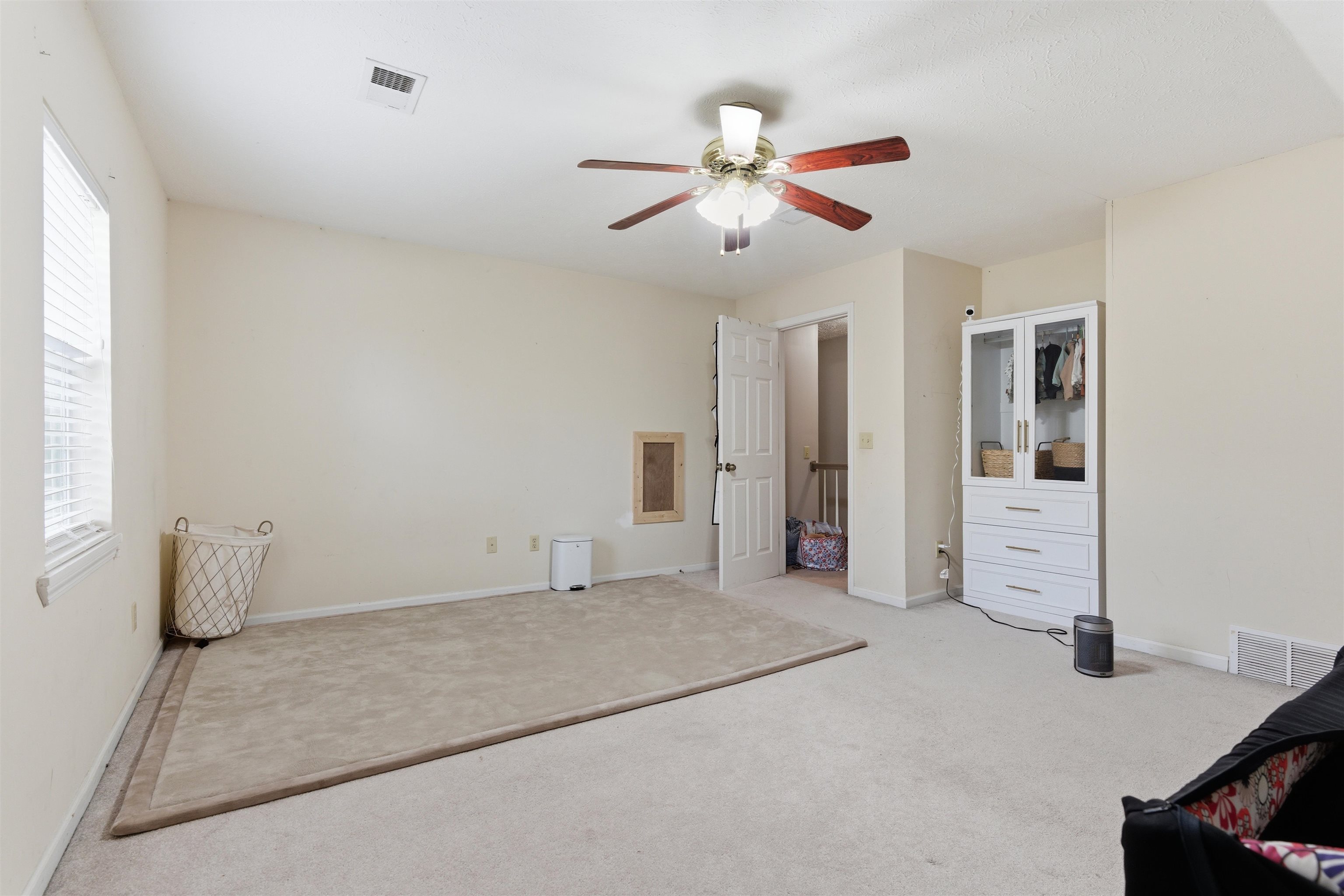 915 Cliffview Road Bolivar, TN 38008 - Photo 27 of 35 a view of a livingroom with a chandelier fan and windows
