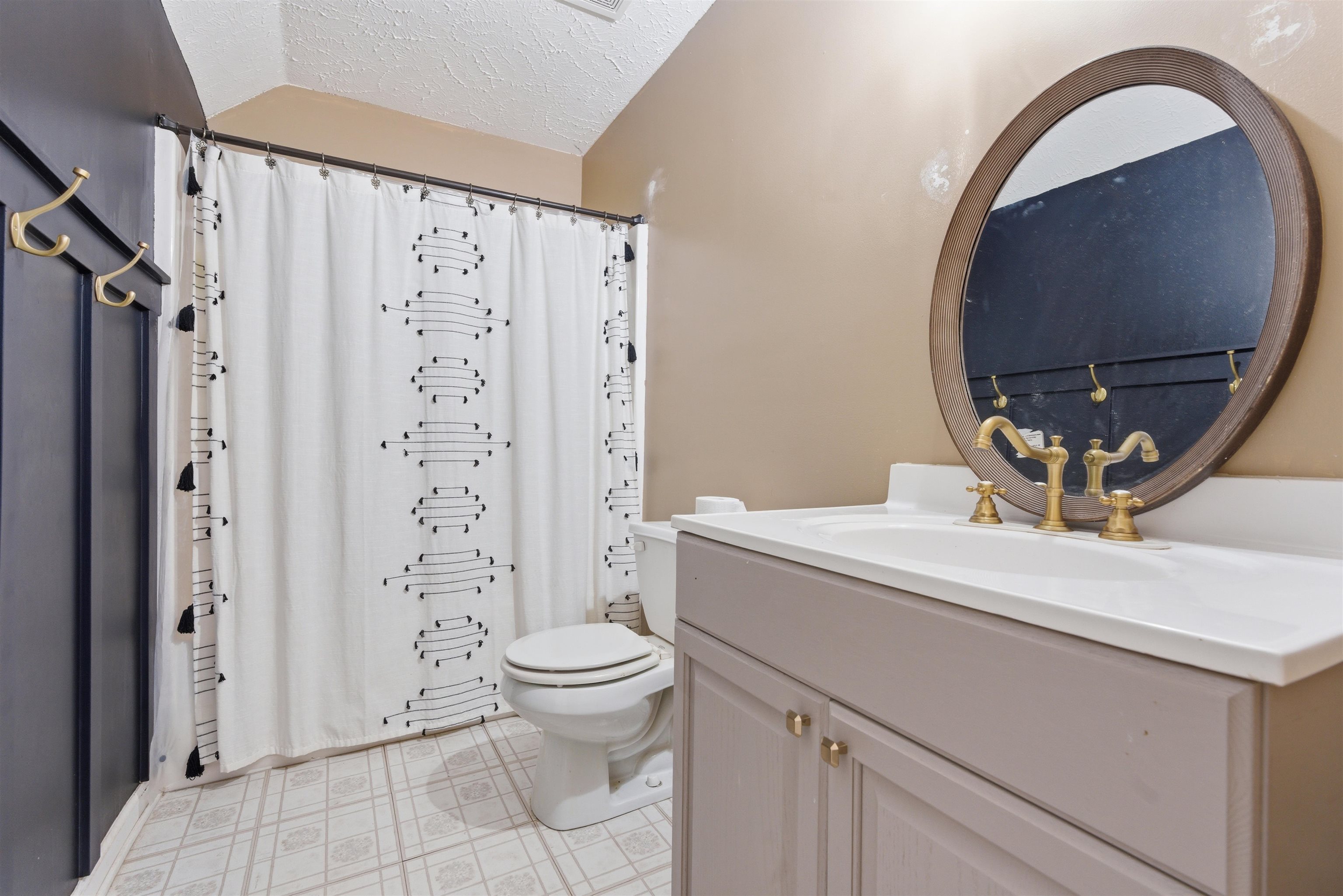 915 Cliffview Road Bolivar, TN 38008 - Photo 32 of 35 a bathroom with a sink a toilet and a mirror