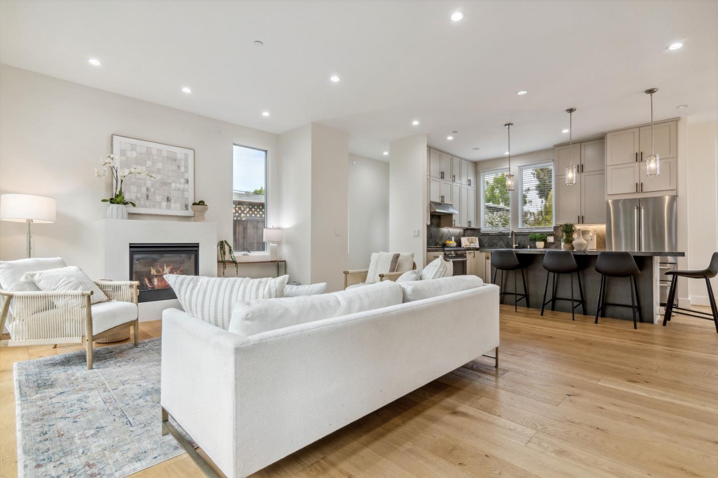 910 Cedar Street Berkeley, CA 94710 - Photo 1 of 39 a living room with furniture a table and kitchen view