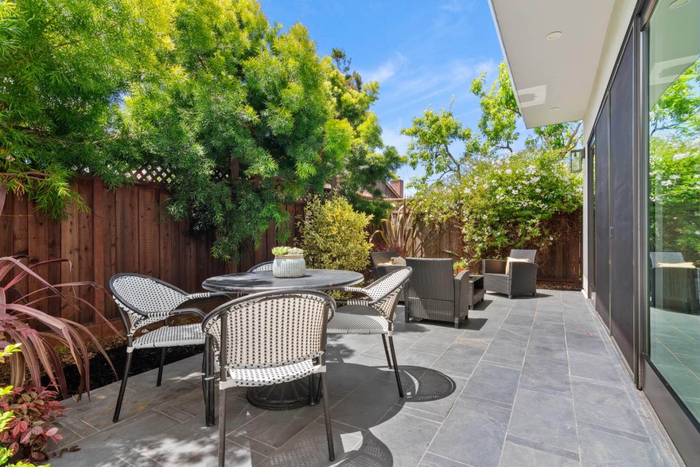 910 Cedar Street Berkeley, CA 94710 - Photo 12 of 39 a view of a chairs and table in backyard of the house