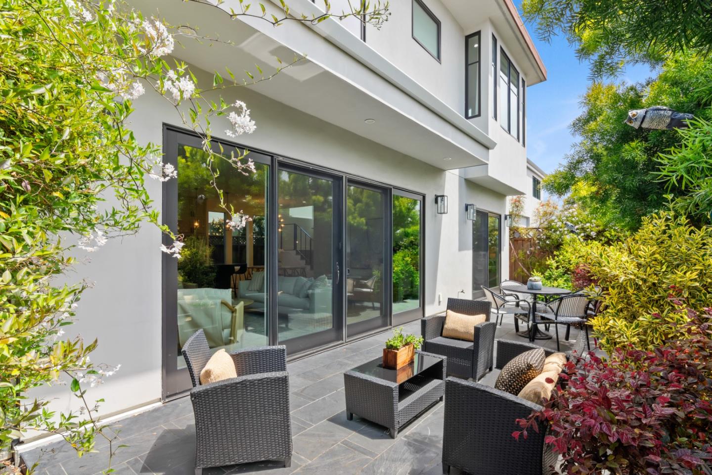 910 Cedar Street Berkeley, CA 94710 - Photo 15 of 39 a view of a patio with couches and table and chairs and potted plants