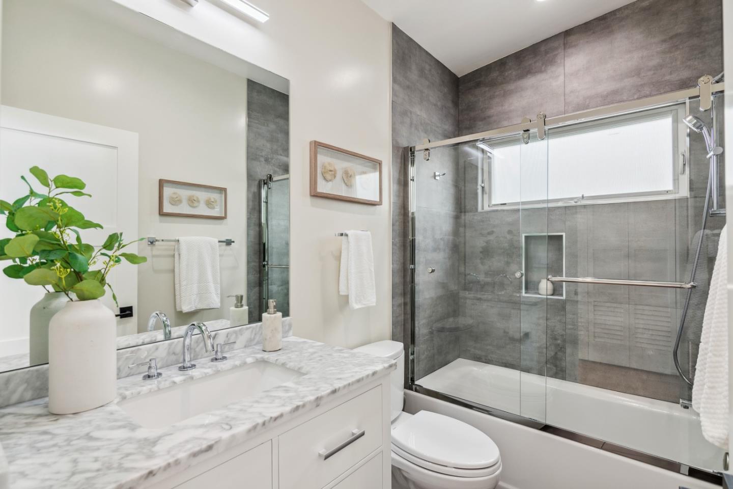 910 Cedar Street Berkeley, CA 94710 - Photo 22 of 39 a bathroom with a granite countertop sink toilet and shower