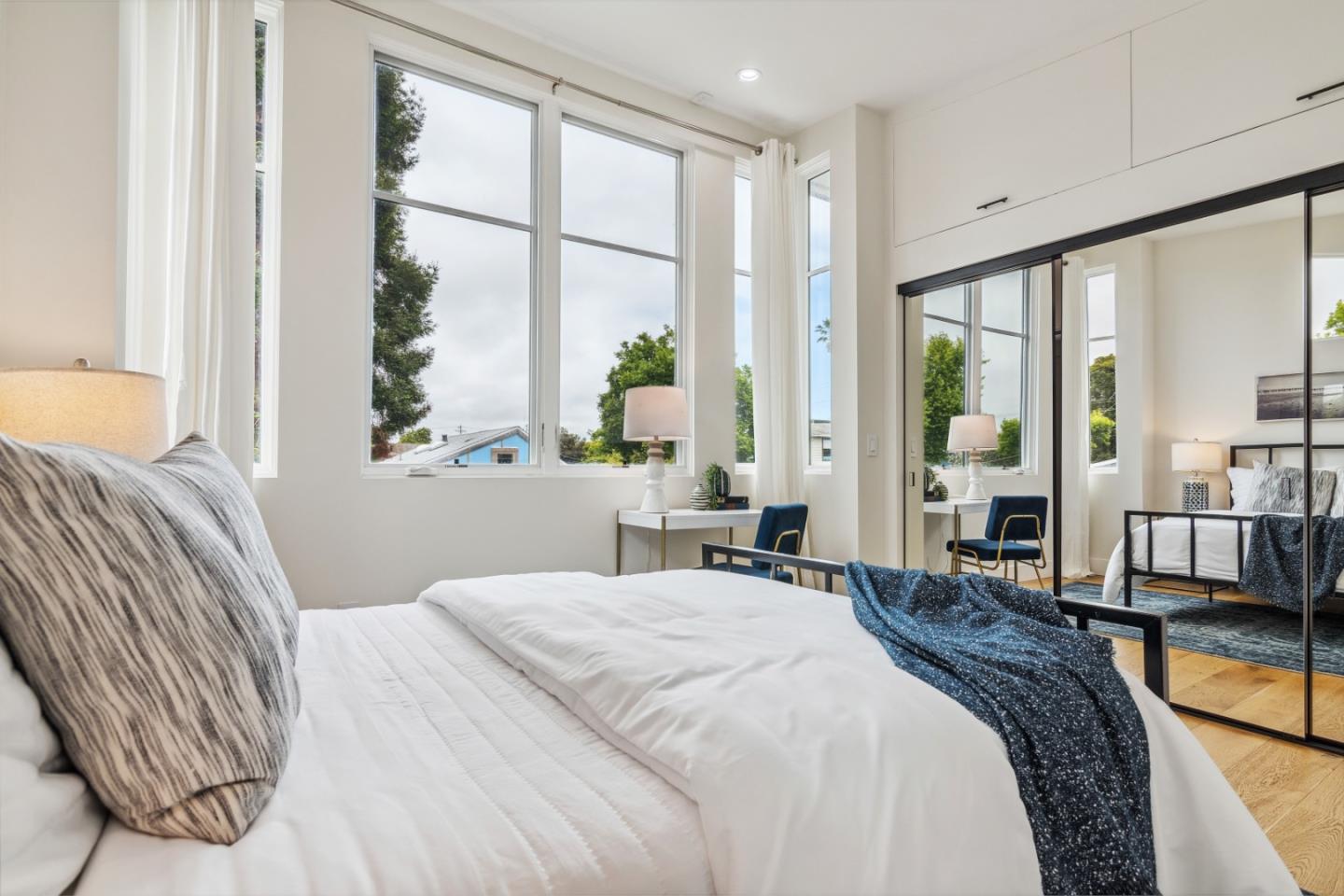 910 Cedar Street Berkeley, CA 94710 - Photo 23 of 39 a bedroom with a large bed and a large window