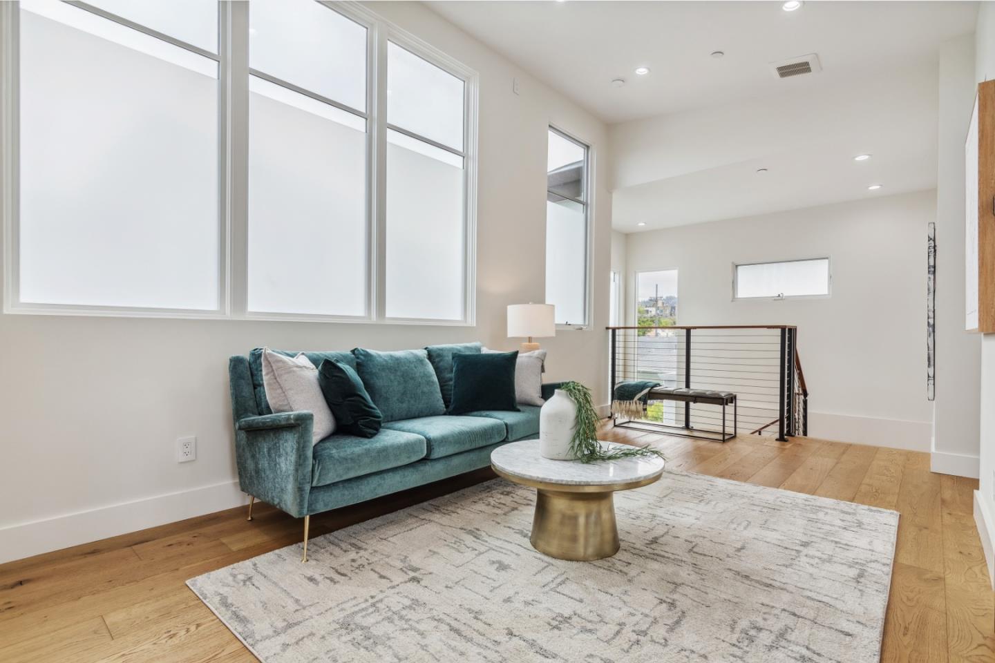 910 Cedar Street Berkeley, CA 94710 - Photo 25 of 39 a living room with furniture a rug and a painting on the wall