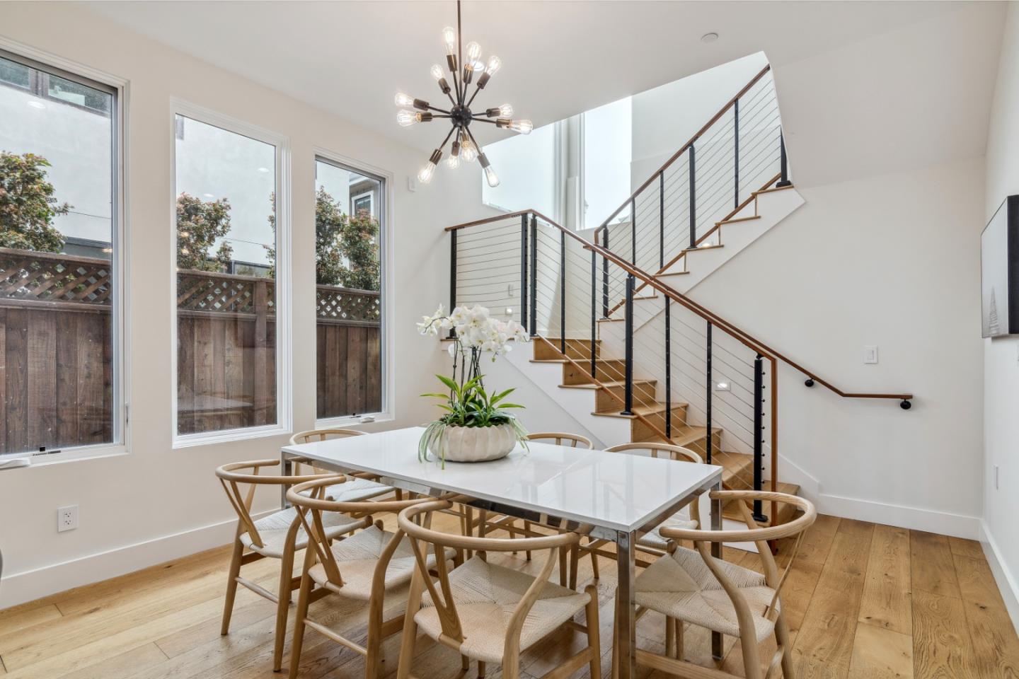 910 Cedar Street Berkeley, CA 94710 - Photo 30 of 39 a view of a dining room with furniture window and wooden floor