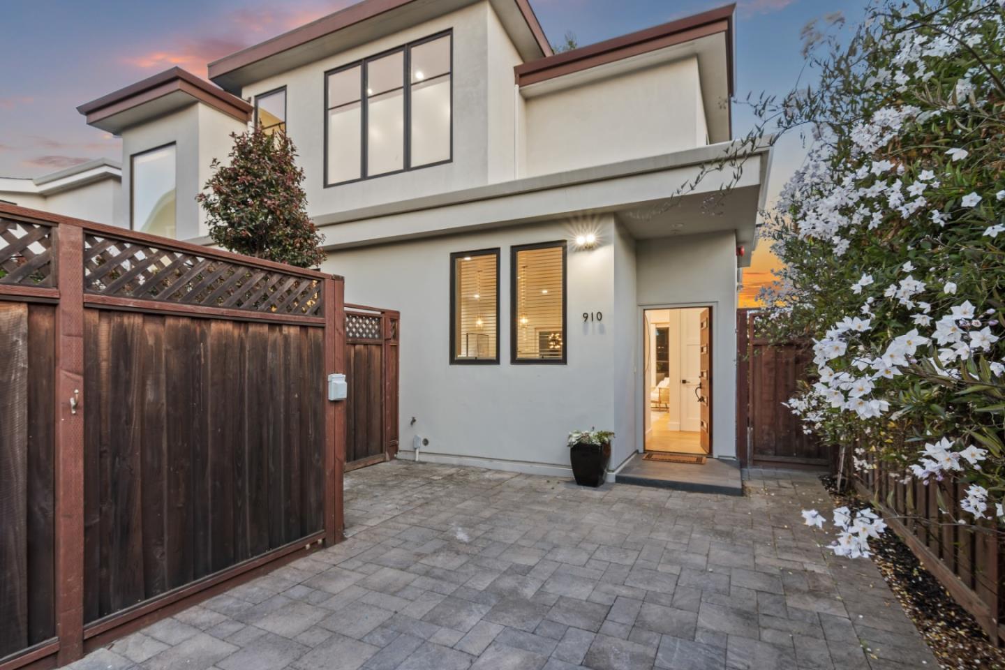 910 Cedar Street Berkeley, CA 94710 - Photo 5 of 39 a view of a house with a wooden fence and a large tree