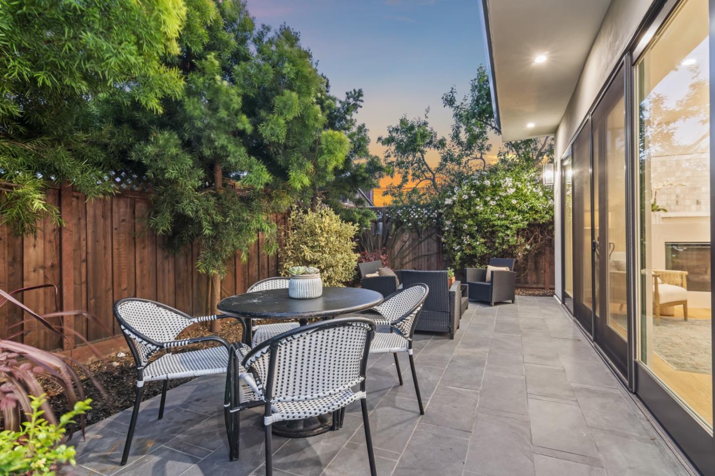 910 Cedar Street Berkeley, CA 94710 - Photo 8 of 39 a view of a patio with table and chairs and potted plants