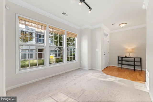 a view of workspace with furniture and window