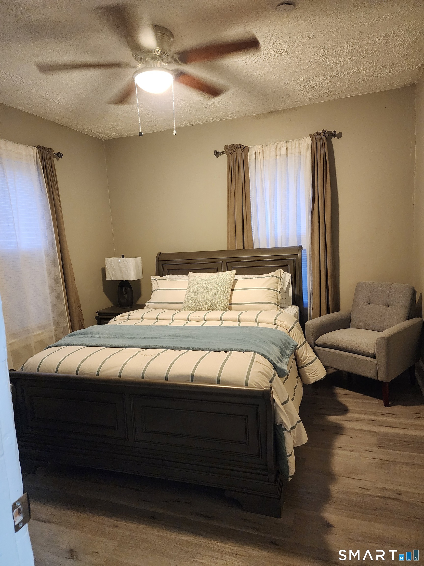 158 North Main Street Ansonia, CT 06401 - Photo 11 of 20 a bedroom with a bed and a couch