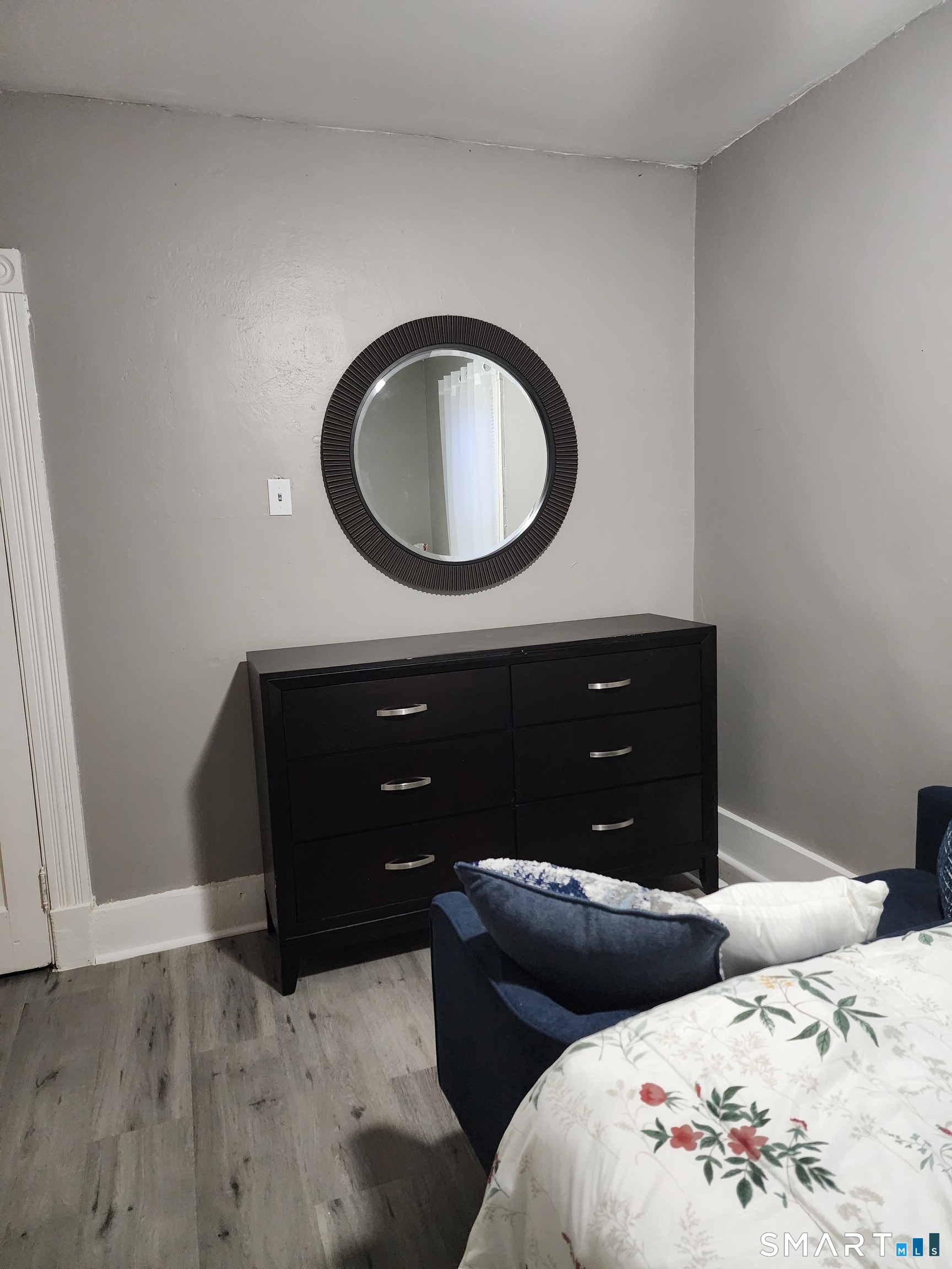 158 North Main Street Ansonia, CT 06401 - Photo 14 of 20 a living room with a couch and a mirror