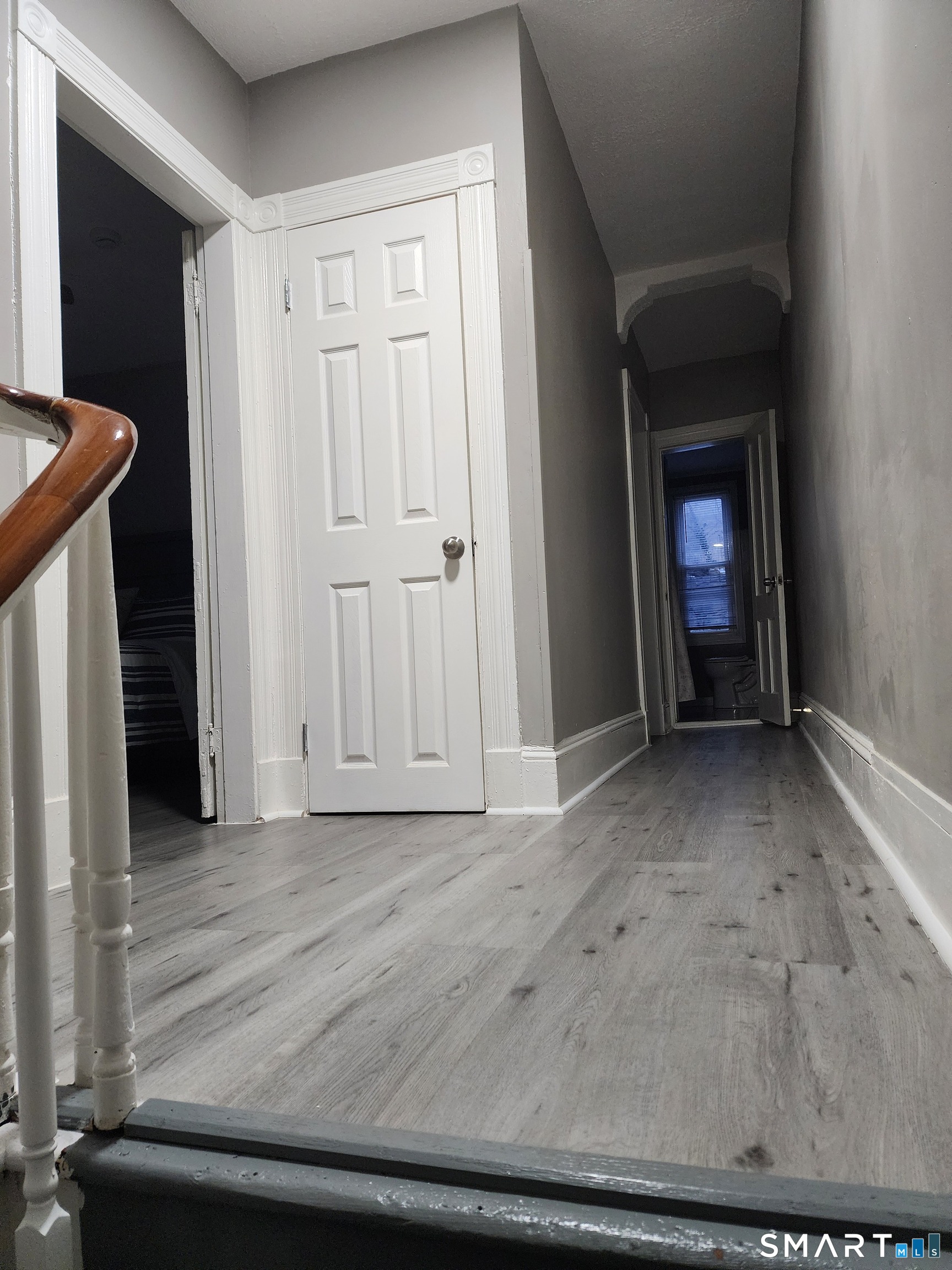 158 North Main Street Ansonia, CT 06401 - Photo 9 of 20 a view of a livingroom with wooden floor and a fireplace