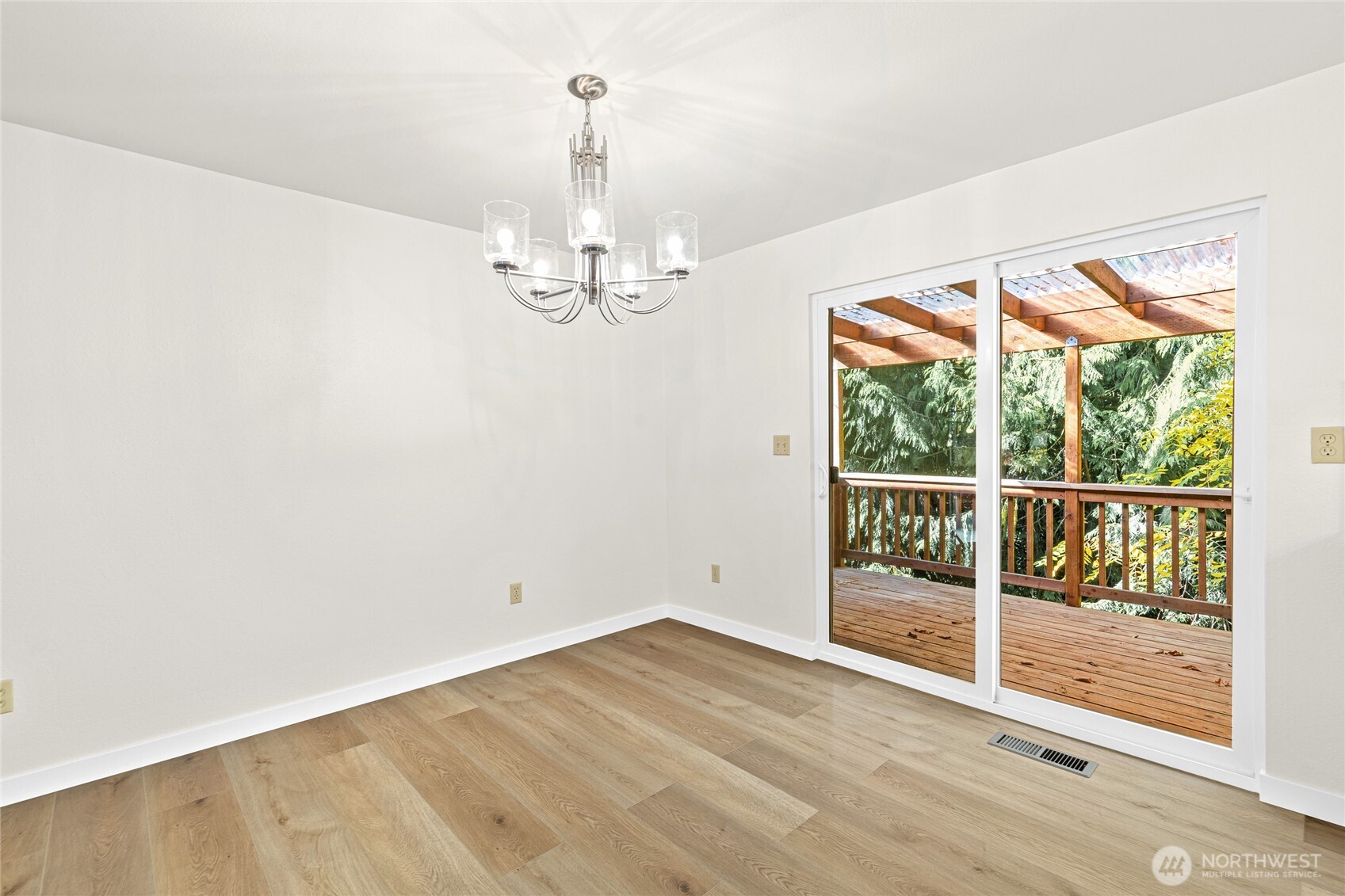 12718 Southeast 184th Place Renton, WA 98058 - Photo 11 of 34 a view of empty room with wooden floor and fan