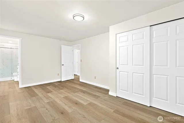 an empty room with wooden floor