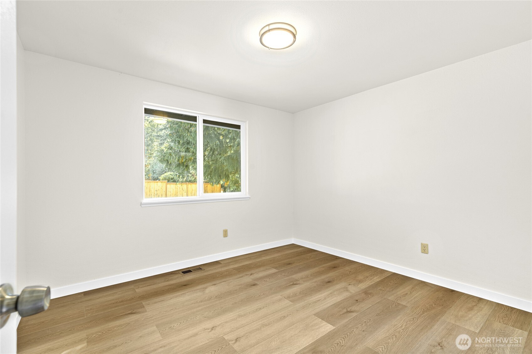 12718 Southeast 184th Place Renton, WA 98058 - Photo 21 of 34 an empty room with a window