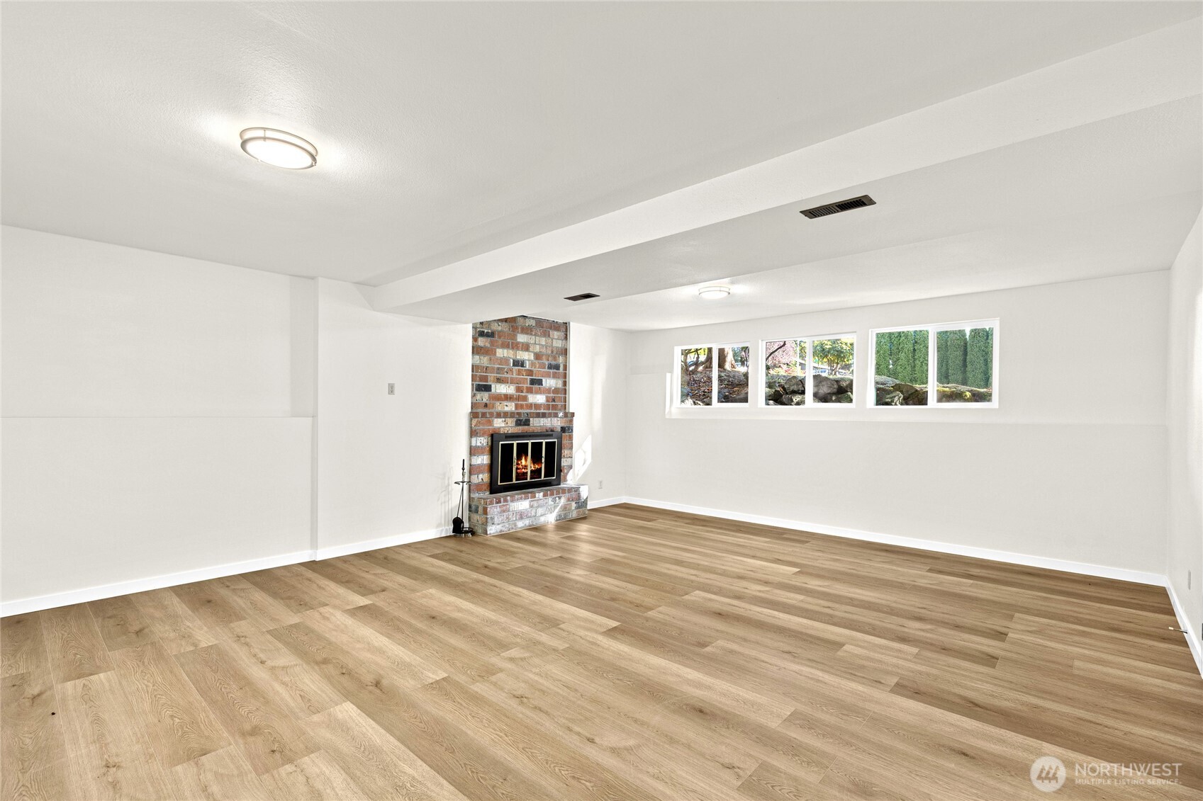 12718 Southeast 184th Place Renton, WA 98058 - Photo 25 of 34 a view of an empty room with a window