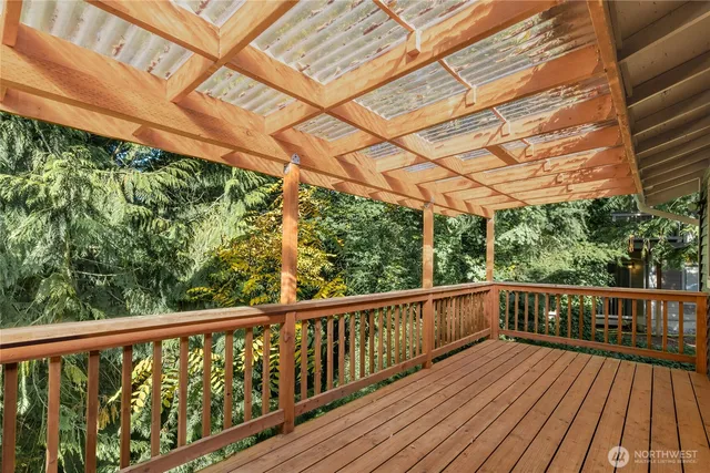 a view of a balcony with wooden floor