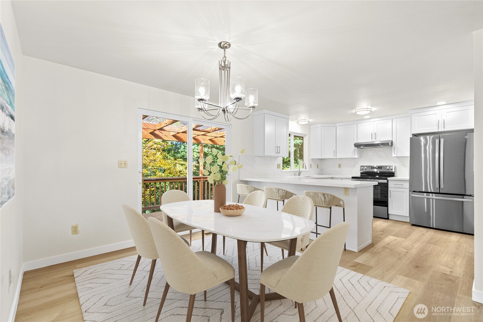 12718 Southeast 184th Place Renton, WA 98058 - Photo 10 of 34 a view of a dining room with furniture window and wooden floor