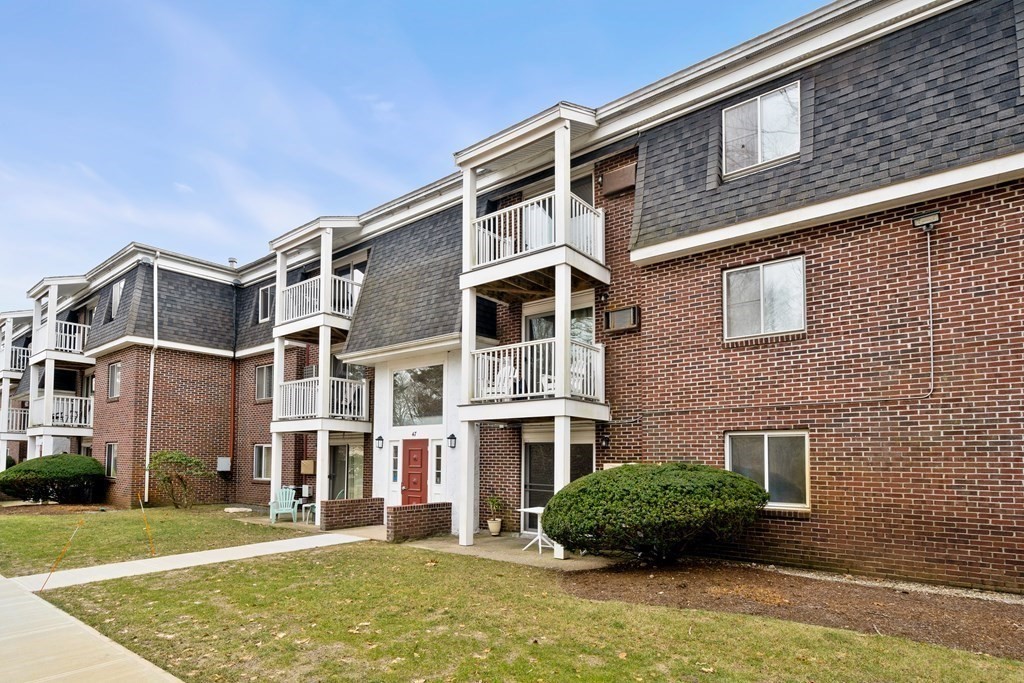 a front view of a building with garden