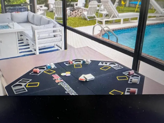 a view of swimming pool with a patio