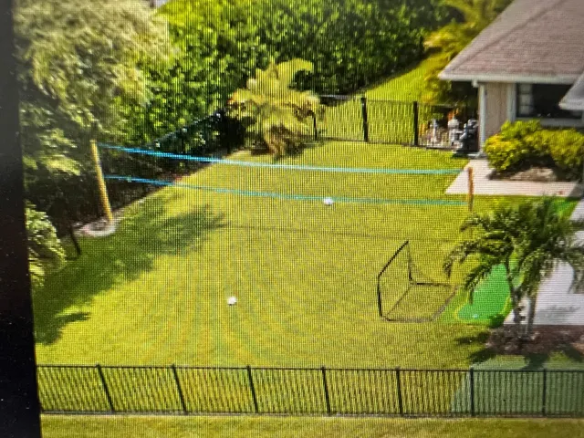 a view of a swimming pool with a garden