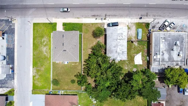 an aerial view of residential houses with outdoor space
