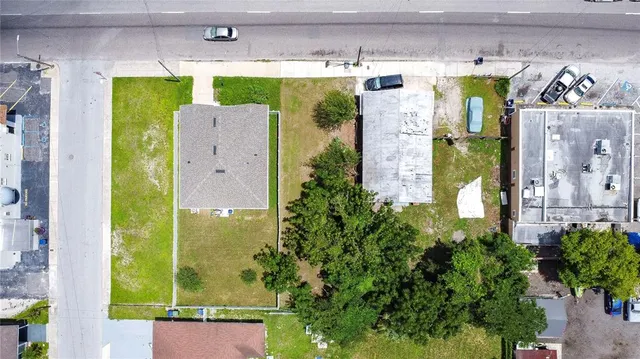 an aerial view of residential houses with outdoor space