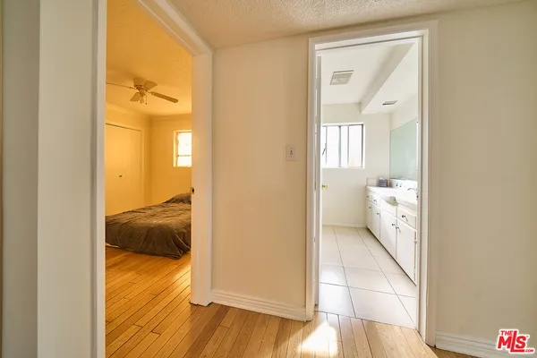 a view of a bathroom from a hallway