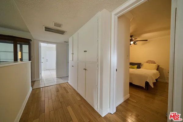 a view of a bedroom from a hallway