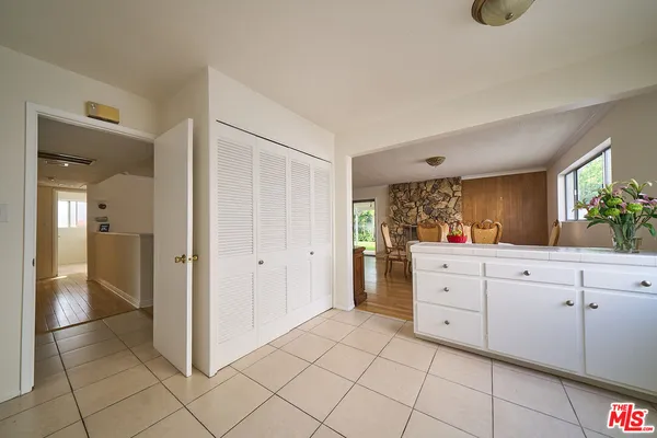 a room with a dresser and a mirror