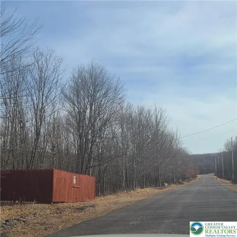 a view of road and trees