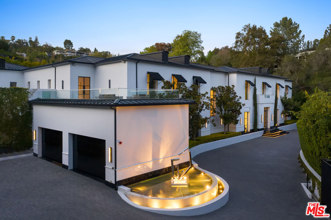10701 Bellagio Road Los Angeles, CA 90077 - Photo 2 of 36 a view of a house with roof yard