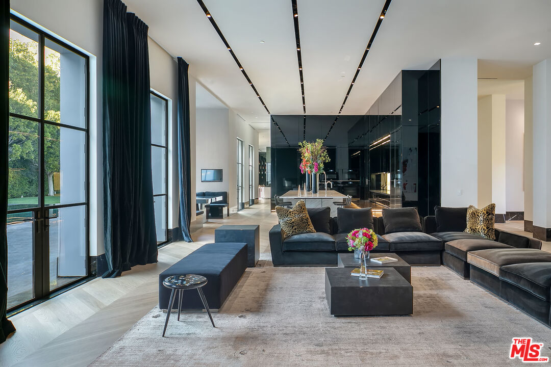 10701 Bellagio Road Los Angeles, CA 90077 - Photo 11 of 36 a living room with furniture and a large window