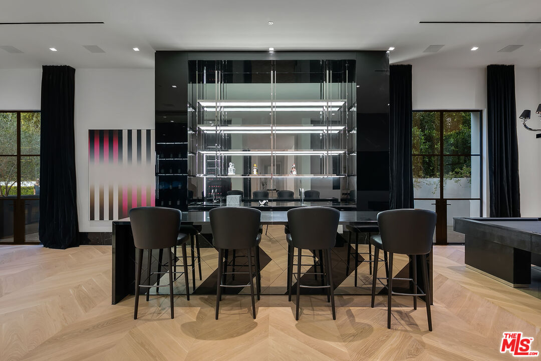 10701 Bellagio Road Los Angeles, CA 90077 - Photo 16 of 36 a view of a dining room with furniture